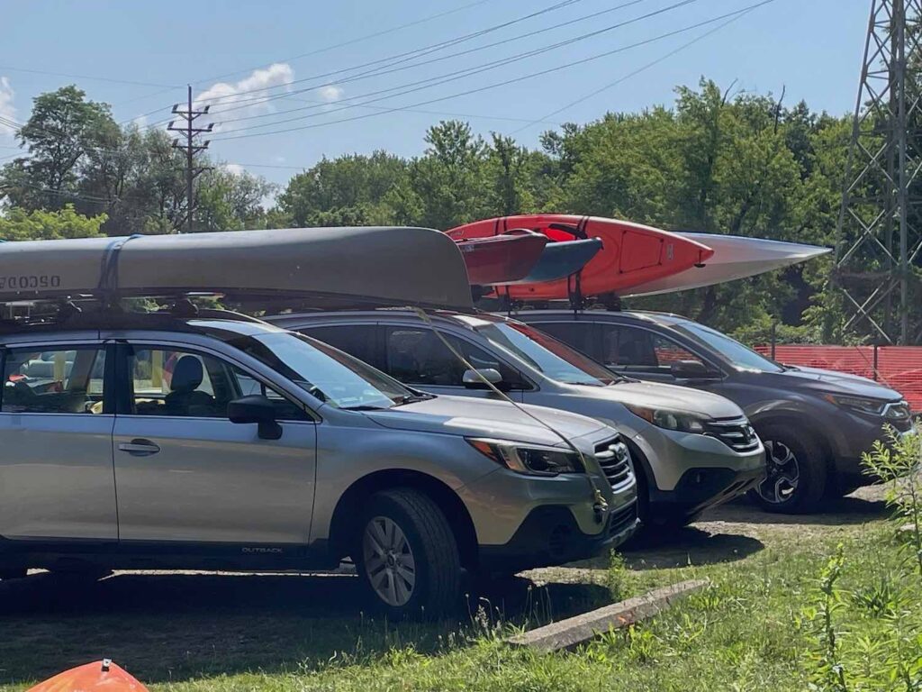 Kayaks are on cars as the Cleveland Fagowees go on a kayaking trip
